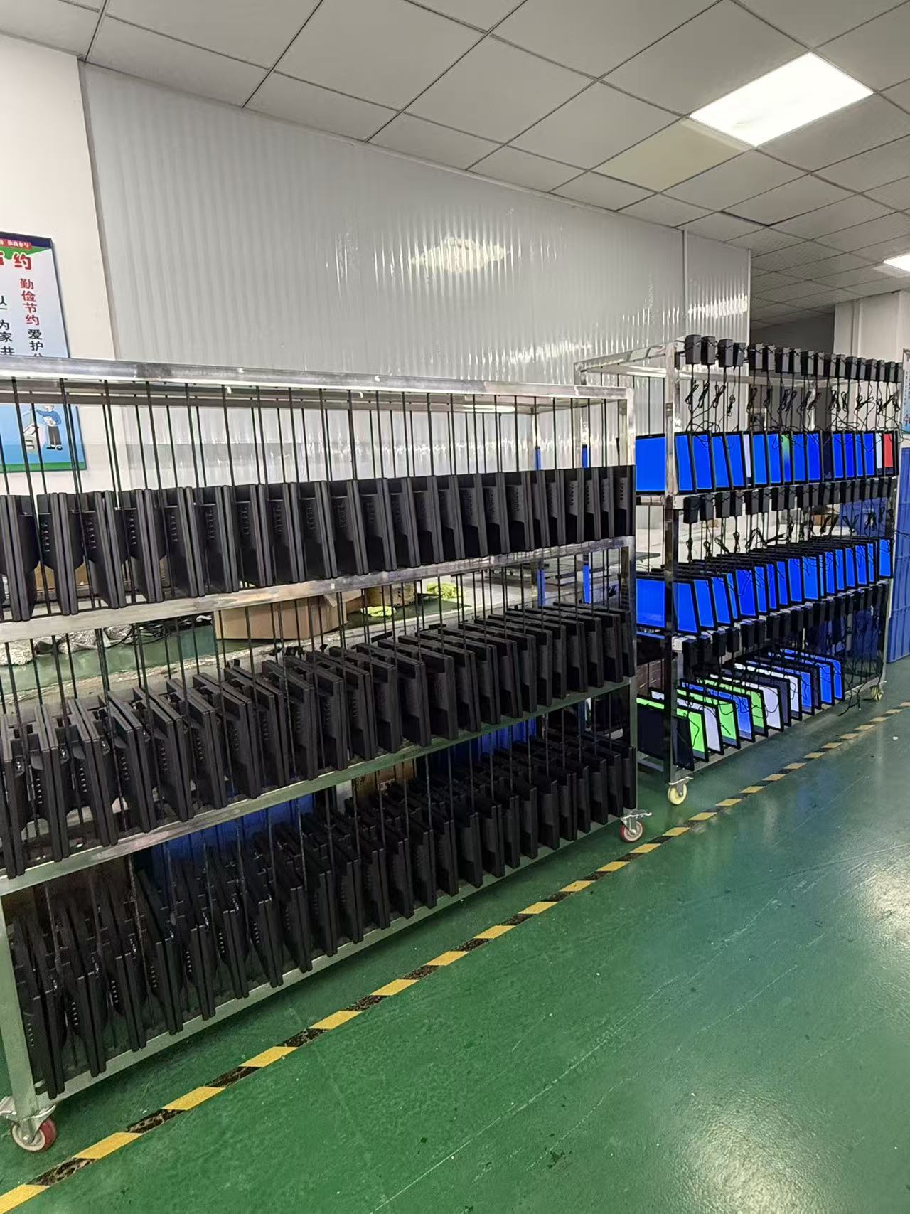 Finished monitors undergoing an aging test at Yanxun Display