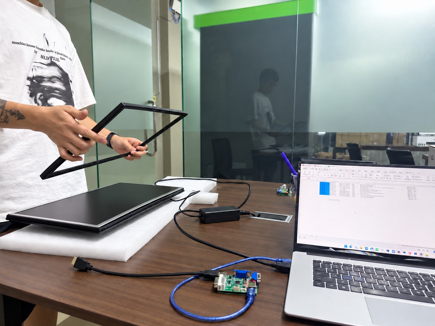 Technician providing monitor warranty repair support